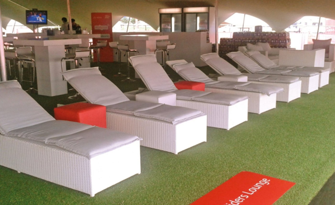 NineCourts temporary Astro Turf flooring beneath a marquee event lounge with seating