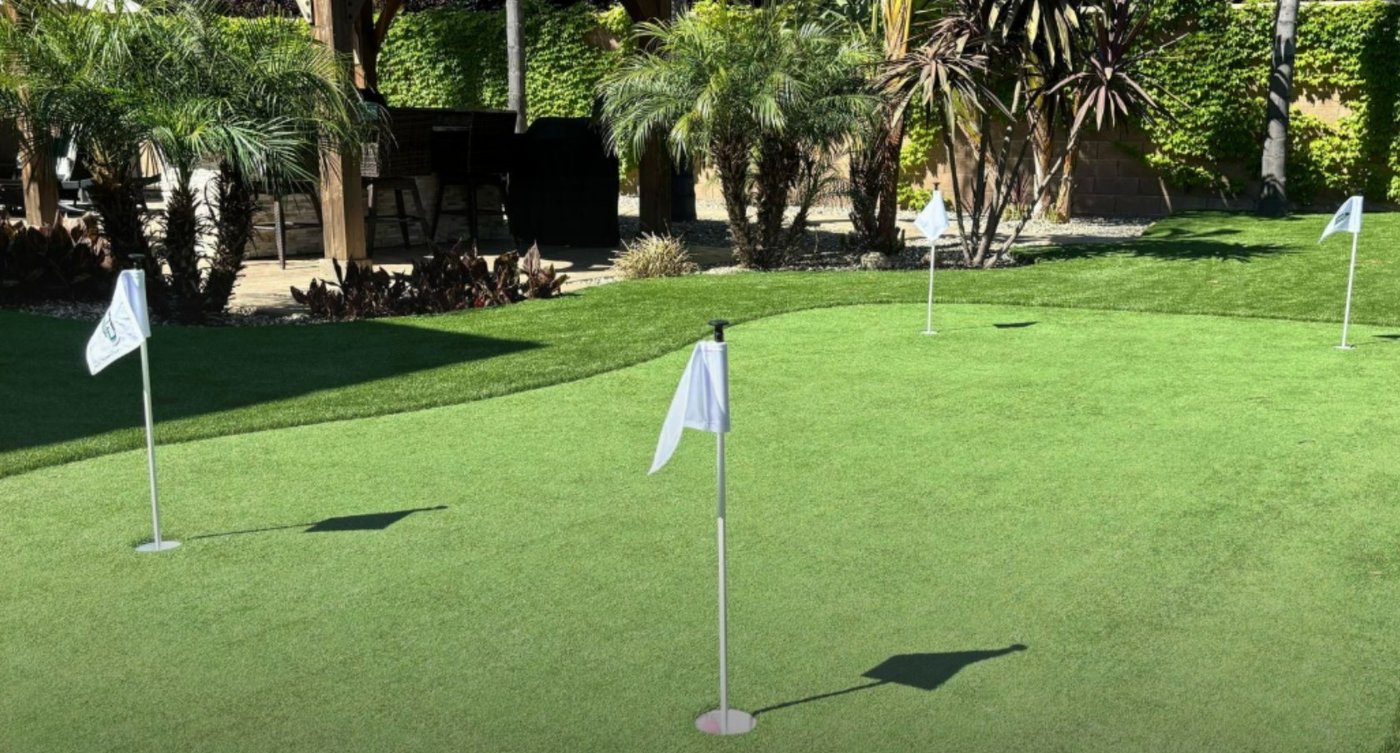 Bespoke Astro Turf putting green installation with multiple holes and flag markers
