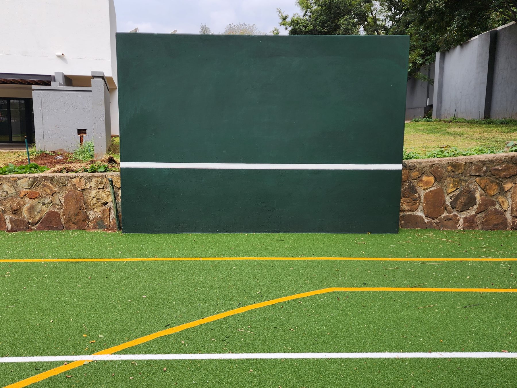 Sandhurst private client Astro Turf court — finished bi-colour multi-sport surface with chain link fencing by NineCourts