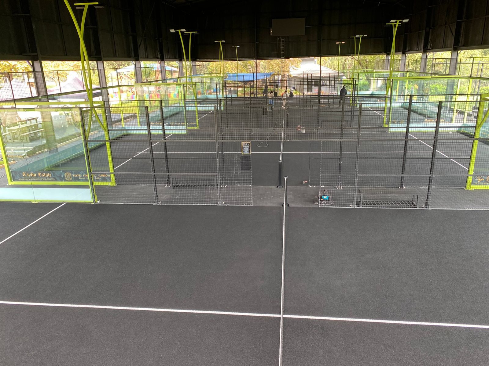 Tayfin Country Club finished padel facility — multiple completed black padel courts with new centre line posts and nets